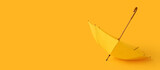 Fototapeta Kawa jest smaczna - Open umbrella on yellow background with space for text