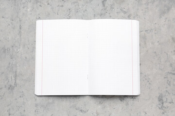 Blank copybook pages on grey grunge background