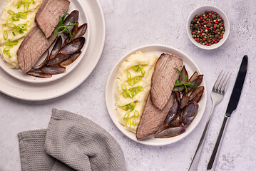 Wall Mural - Food photography of roasted beef, joint, fillet, mashed potatoes, onion, rosemary, garlic, pepper