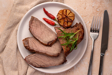 Wall Mural - Food photography of roasted beef, joint, fillet, rosemary, garlic, chili