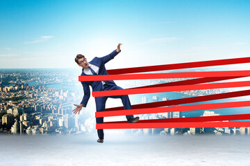 Wall Mural - Businessman being harnessed and restricted