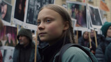 Fototapeta  - Young girl by Fridays for future protest on city street. Activists against global warming. Fridays for future street demonstration. Student demonstration against climate change and global warming