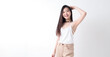 © Surachetsh - Portrait of Cute Asian Woman, She raises her arm to show her Smooth armpit skin and looks at the camera on a White background in Studio light. generative AI.