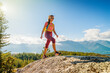 © Maridav - Hiking people. Woman hiker on mountain hike trail enjoying view wearing backpack and hiking clothing in beautiful blue sky nature landscape. Squamish hike, British Columbia, Canada.