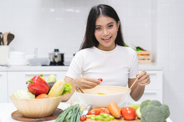 Wall Mural - Eat healthy food for good wellness health concept. Woman cooking salad menu with fresh organic vegetables