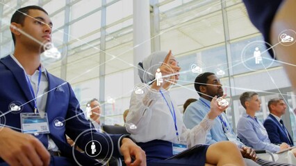 Poster - Animation of network of digital icons against woman in hijab talking at business conference