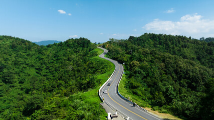 Wall Mural - aerial view ROAD No.1081 or shape number three of winding mountain road between Pua District, Nan Province, Thailand is highlight point and landmark that tourist like to take pictures 