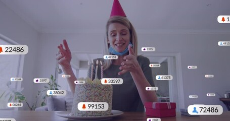 Poster - Animation of social media icons with numbers over caucasian woman having birthday video call