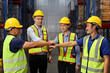 © feeling lucky - Group of engineer or worker in protective suit with hardhat standing and stacking hands celebrate successful together or completed deal commitment at heavy industry manufacturing factory or warehouse
