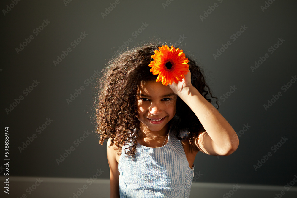 Portrait of happy African American child girl with curly hair with ...