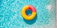 Inflatable Ring Colorful In Pool On Sunny Day. Relaxation Lifestyle Concept. Leisure Lifestyle Concept. Color Background.