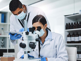 Poster - Building a better tomorrow through research. two young researchers working in a laboratory.