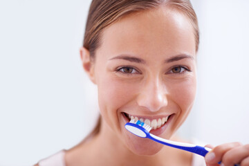 Canvas Print - Woman, portrait and brushing teeth in bathroom with smile, health and self care for oral hygiene, wellness and routine. Girl, toothbrush and happiness for cleaning, healthy mouth and start morning