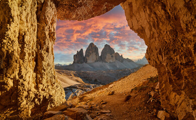 Canvas Print - Panoramic view of famous Dolomites mountain peaks glowing in beautiful golden evening light at sunset in summer, Italy