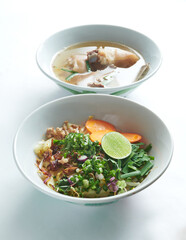 Pho Bo vietnamese soup with beef and rice noodles isolated on a white background