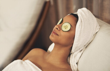 Wall Mural - Indulging in some much-needed me time. a woman relaxing in a spa with cucumber slices on her eyes.