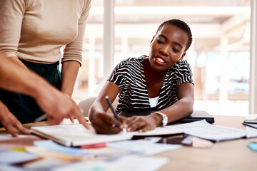 Aufkleber - Creativity solves problems faster and easier. a young businesswoman working with her colleagues in an office.