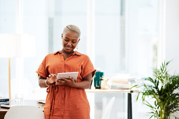 Sticker - Be smart about the way you work. a young businesswoman using a digital tablet in an office.