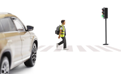 Wall Mural - Car waiting and a boy wearing a reflective vest and walking at a pedestrian crossing