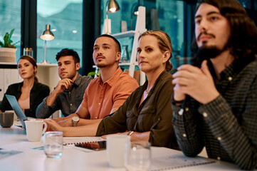 Poster - Theyre eager to learn from the speaker. a group of businesspeople listening to a presentation in the boardroom.