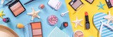 Summer make-up cosmetics flat lay, Vacation, Holiday shopping sale make up.Shadows, lipstick, mascara, face powder, blush, with summer accessories, starfish, shells