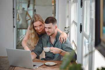 beautiful girl and handsome young man Creative woman working on laptop computer in her studio Two Caucasian Couples Sitting Outside Workplace