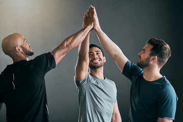 Poster - Lets go boys. a group of handsome young male athletes high fiving against a grey background.