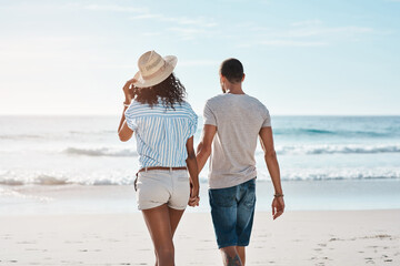 Sticker - I want you by my side throughout life. Rearview shot of a young couple walking along the beach.