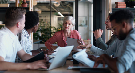 Poster - with the team working as one, success will be done. a group of businesspeople having a meeting in a 