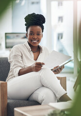 Sticker - Business has been booming lately. a businesswoman using her digital tablet while reading paperwork.