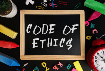 Poster - wooden board with code of ethics text on a background of various colorful subjects