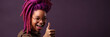 Portrait of a woman with magenta dreadlocks pointing her thumb up, banner on dark magenta background, generative ai illustration