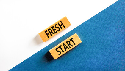 Wall Mural - Fresh start and motivational symbol. Concept words Fresh start on beautiful wooden block. Beautiful white and blue background. Business motivational and Fresh start concept. Copy space.