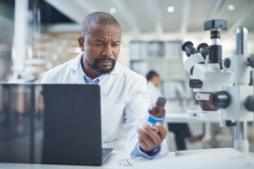 Poster - Are you ready to be rolled out. a scientist using a laptop to conduct research in a laboratory.