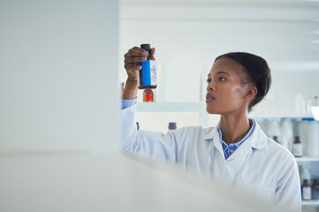 Poster - This will change everything. a young scientist working in a lab.