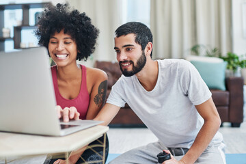 Poster - Were going to try some living-room-friendly workouts. Shout of a young couple using a laptop while working out at home.
