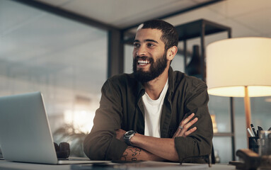 Poster - Cant wait to smash more goals tomorrow. a young businessman using a laptop during a late night at work.