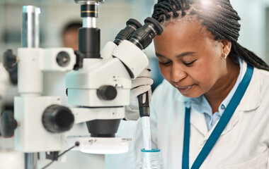 Wall Mural - conducting beneficial tests. a young scientist working with samples in a lab.