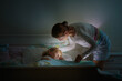 © famveldman - Child sleeping in dark bedroom. Little boy napping
