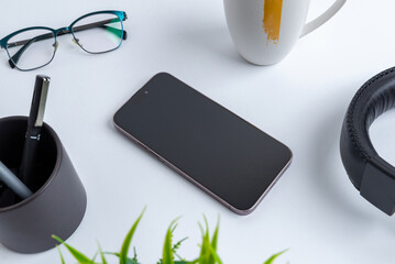 Fototapete - Blank phone on office desk. Professional business composition