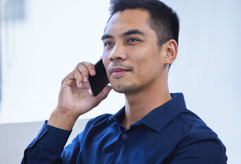 Poster - Reach out to your network if you need some help. a young businessman talking on a cellphone in an office.