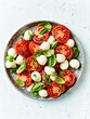 Caprese salad with mozzarella balls and cherry tomato. Top view