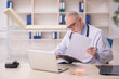 © Elnur - Old male doctor working in the clinic