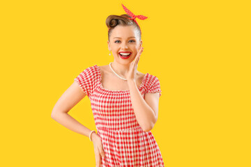 Poster - Young pin-up woman on yellow background