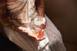 © C Malambo/peopleimages.com - Its not the morning without a multivitamin. a woman taking a pill with a glass of water during her morning routine at home.