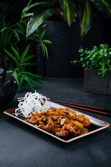 Wall Mural - Fried Asian chicken with onion, celery, cashew nuts in sauce.