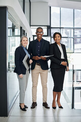 Poster - Winning is possible and it all starts with the team. Portrait of a group of businesspeople working together in a modern office.