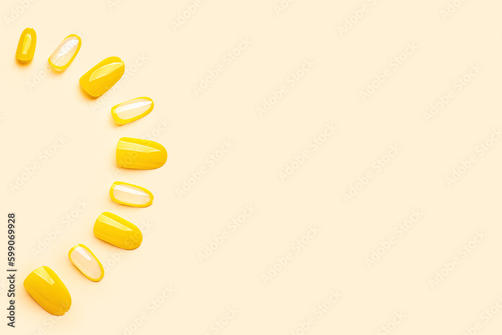 Press-on nails on beige background