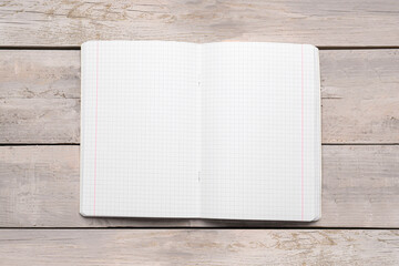 Copybook with blank pages on grey wooden table