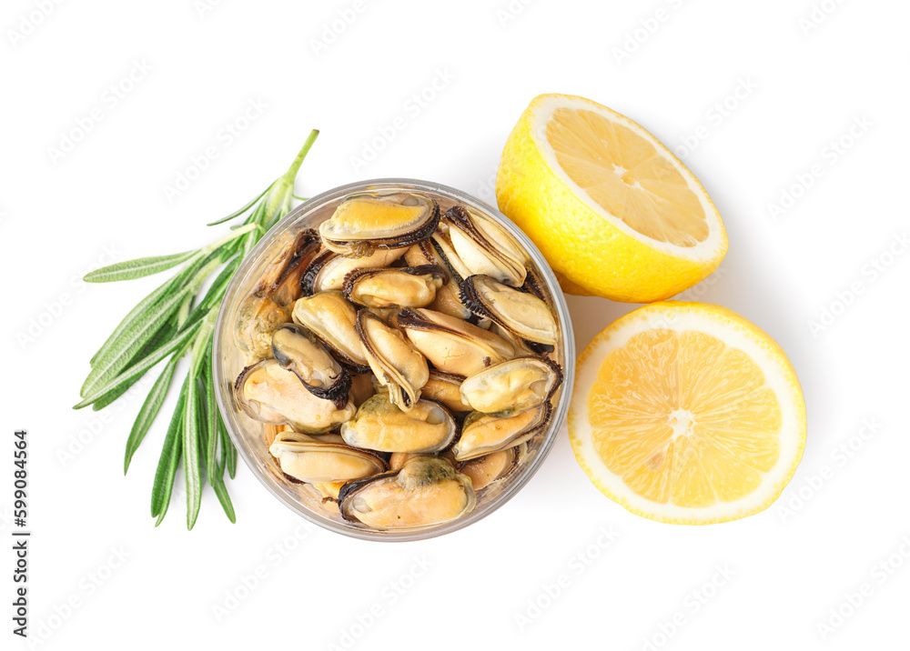 Marinated mussels in glass with lemon halves on white background